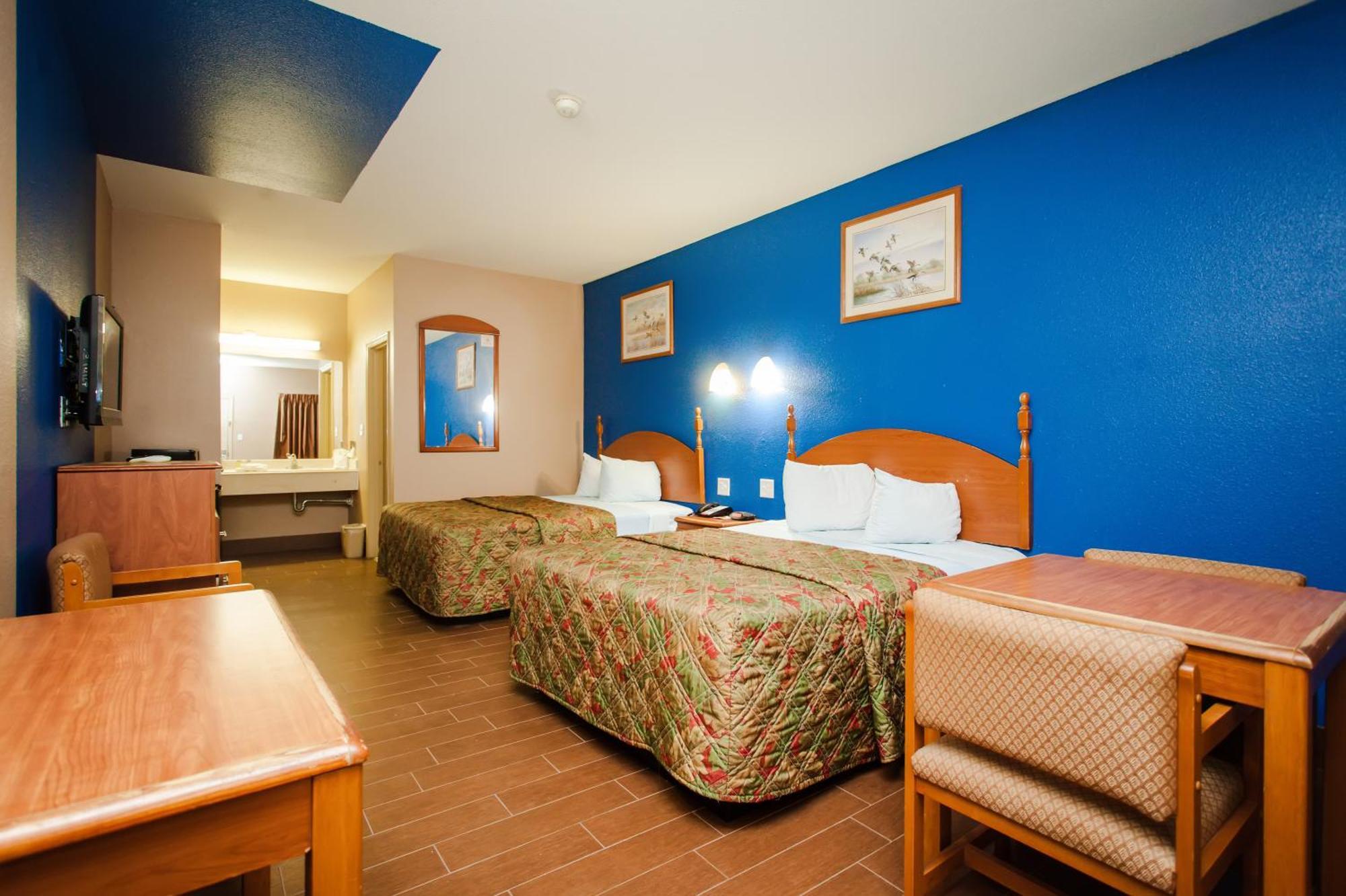 Scottish Inn & Suites Hankamer Habitación foto